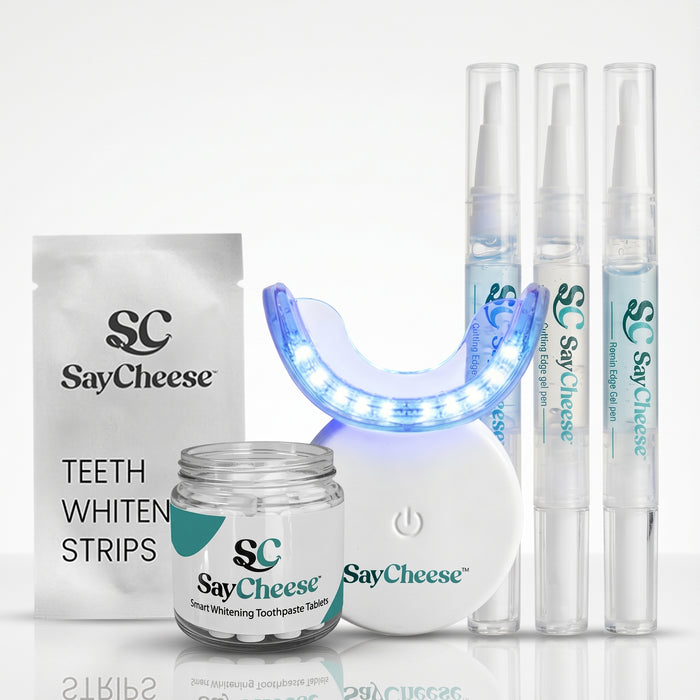 SayCheese teeth whitening product set including strips, gel, and light on a white background